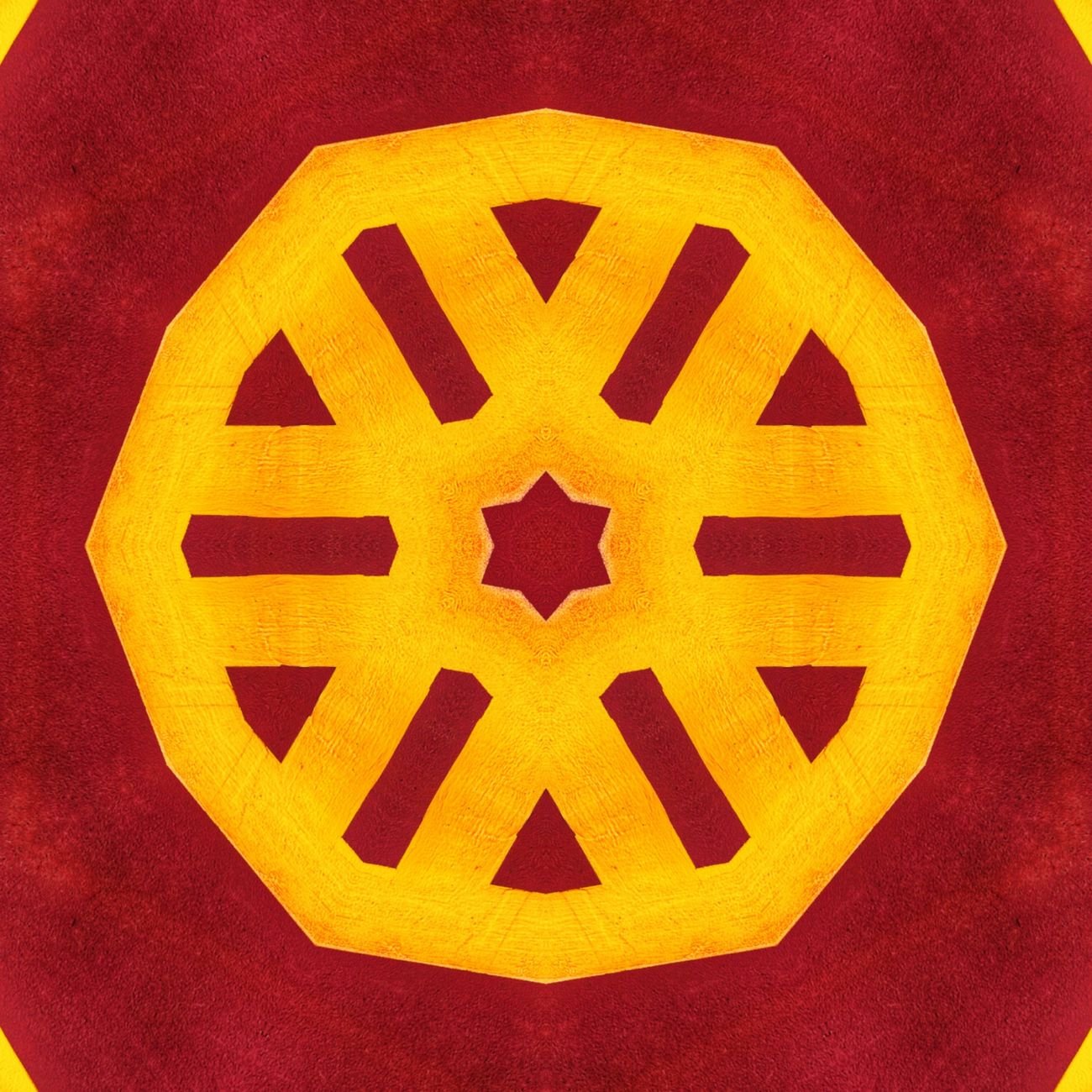 Colorful geometric mandala pattern with a central star and symmetrical shapes.
